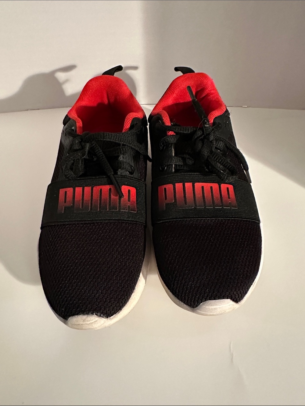 Puma Kids Black Sneakers with Red Accents